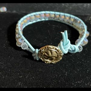 Single wrap bracelet, leather cord, a brass button and beautiful glass beads.